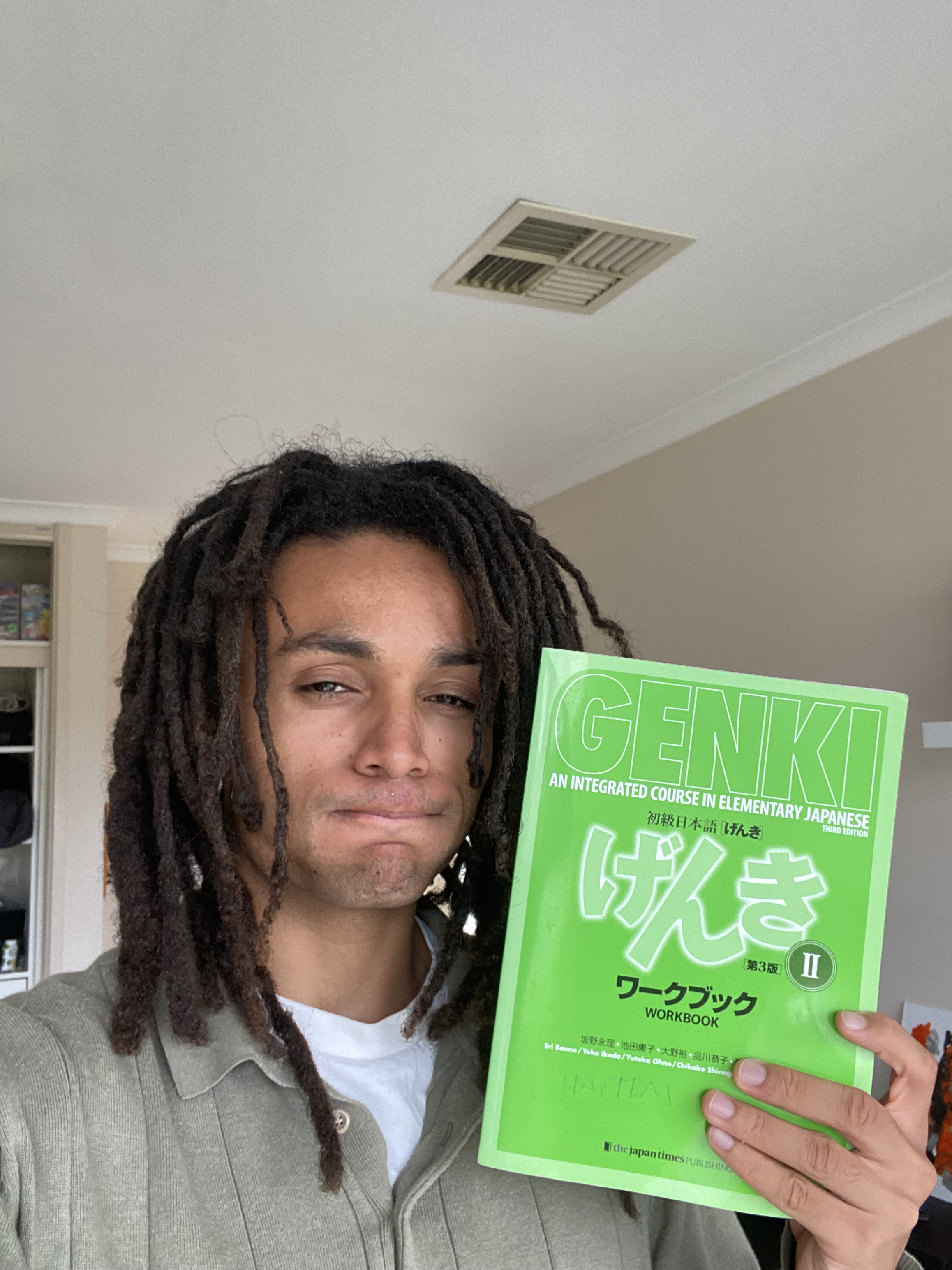 Hakeem studying with a textbook